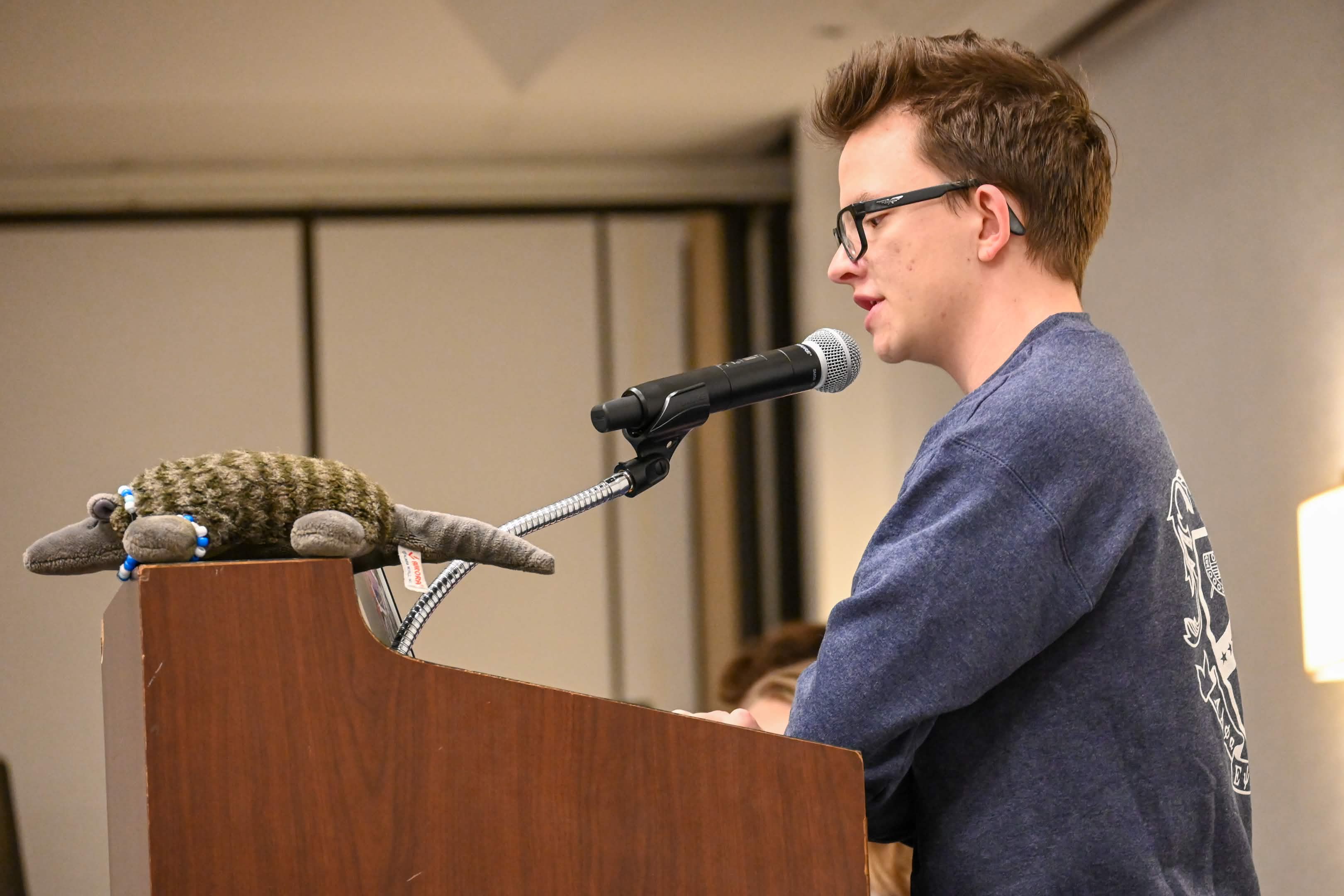 Roman Beames giving a speech to the Kappa Kappa Psi district